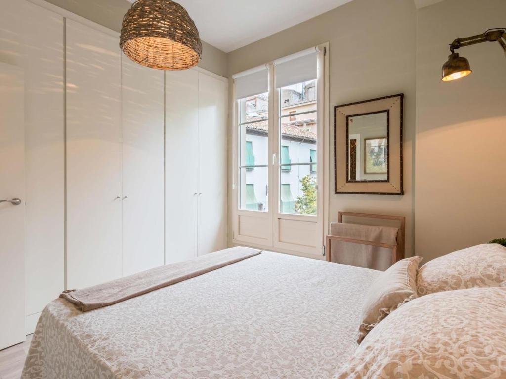 A bed or beds in a room at Trinidad Deluxe 1