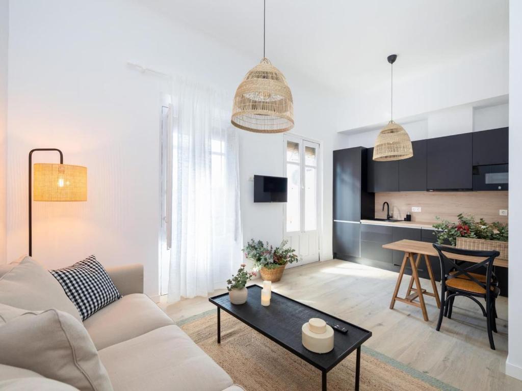 A television and/or entertainment centre at Bright and Elegant Gran Via apartments