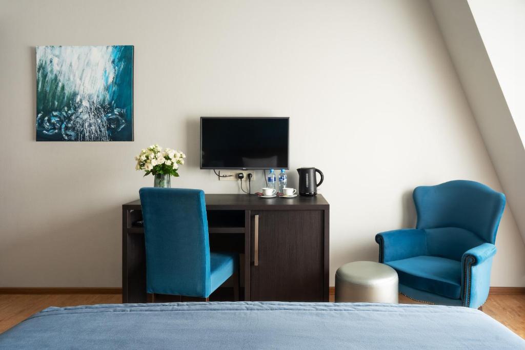 TV a/nebo společenská místnost v ubytování Sephia Hotel