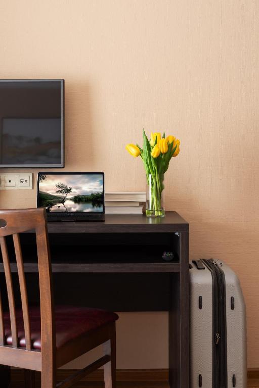 TV a/nebo společenská místnost v ubytování Sephia Hotel