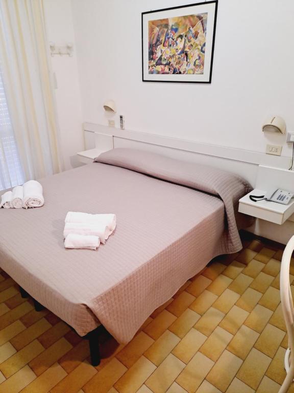 Postel nebo postele na pokoji v ubytování Hotel Helvetia