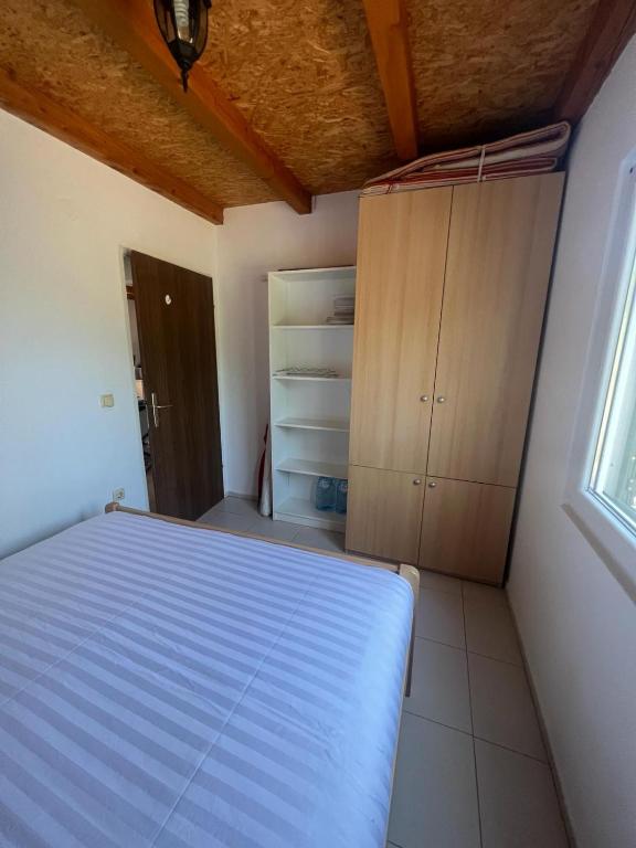 Posteľ alebo postele v izbe v ubytovaní Kuća za odmor Buba, otok Žut