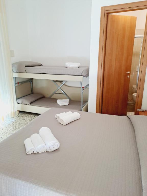 Postel nebo postele na pokoji v ubytování Hotel Helvetia
