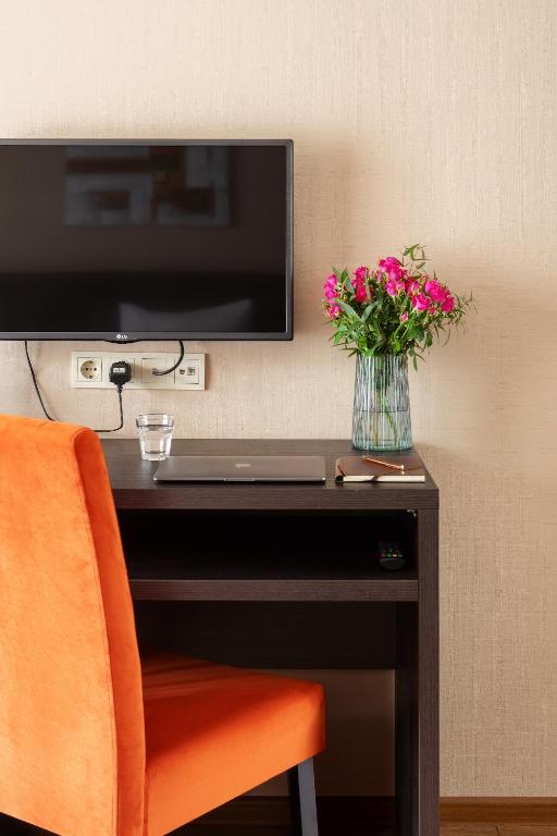 TV a/nebo společenská místnost v ubytování Sephia Hotel