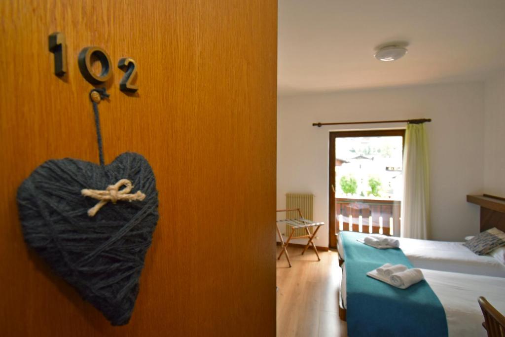 Postel nebo postele na pokoji v ubytování Hotel Comelico