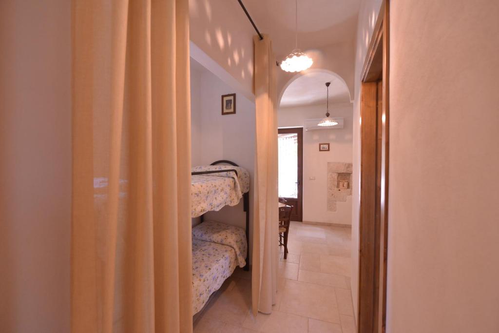 Postel nebo postele na pokoji v ubytování Masseria Pentima Vetrana Resort