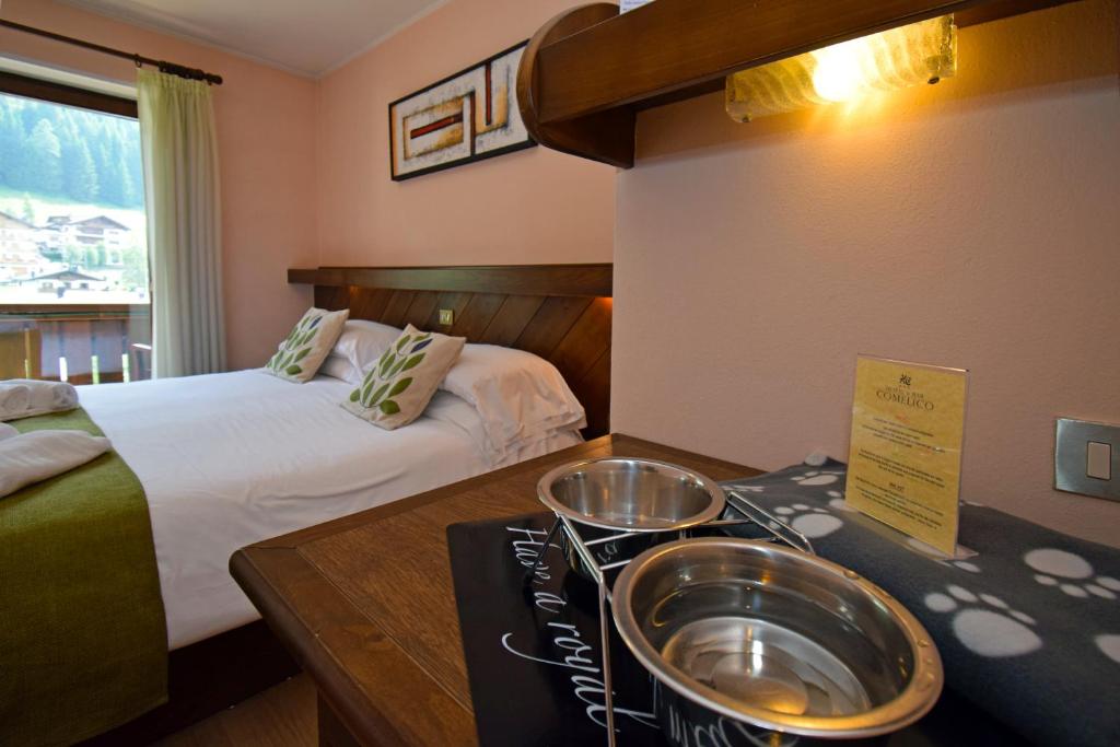 Postel nebo postele na pokoji v ubytování Hotel Comelico