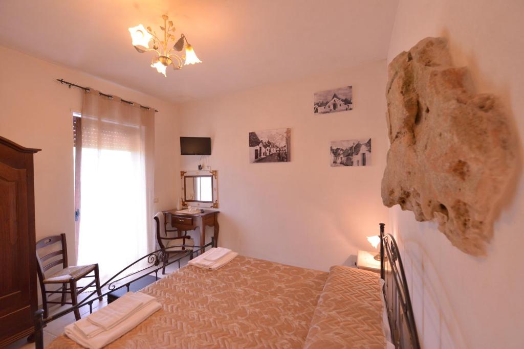 Postel nebo postele na pokoji v ubytování Masseria Pentima Vetrana Resort