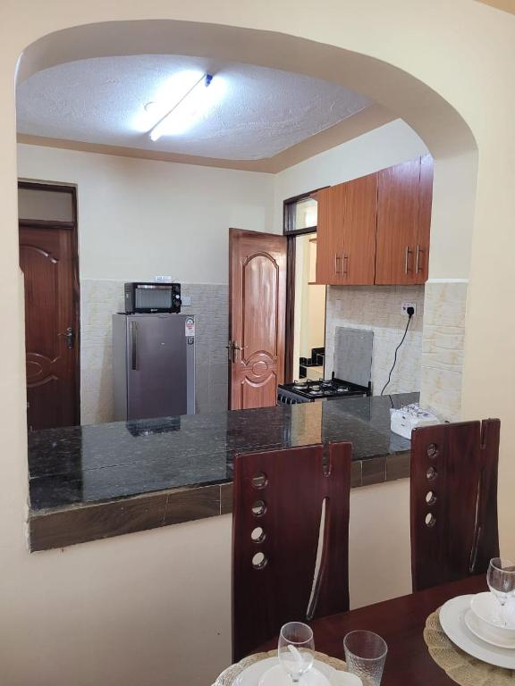 Kuchyň nebo kuchyňský kout v ubytování Gloria House
