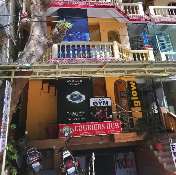 a building with a banner on the side of it at Casa di Mara in Puttaparthi