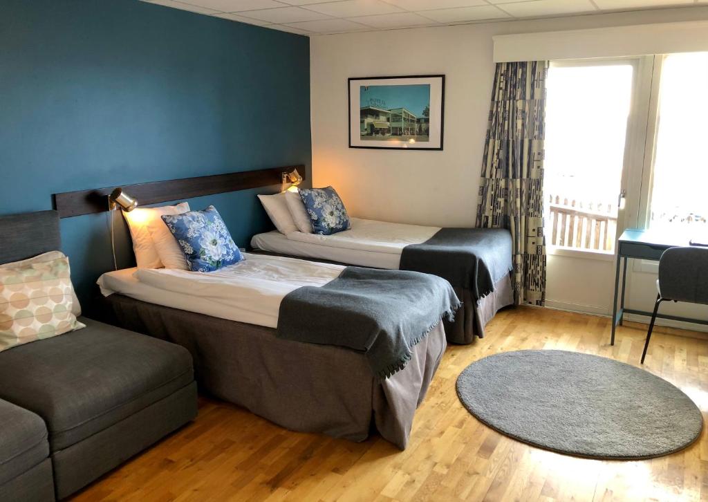 מיטה או מיטות בחדר ב-Vätterleden Hotell & Restaurang