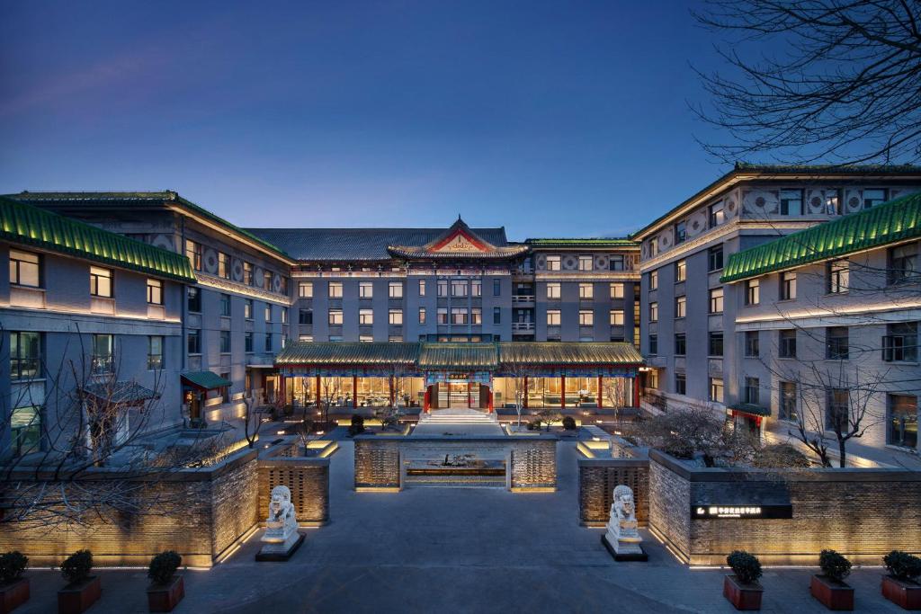 an exterior view of a building with a courtyard at SSAW Garden Hotel Beijing in Beijing