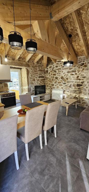 a dining room with a table and chairs at Casa do Rio - AL in Valença