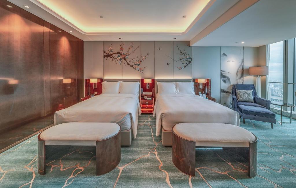 Postel nebo postele na pokoji v ubytování Na Lotus Hotel, a Luxury Collection Hotel, Nanning