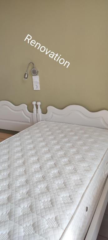A bed or beds in a room at Krinelos Rooms