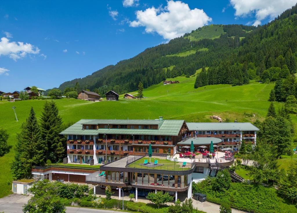 an aerial view of a hotel in the mountains at IFA Alpenhof Wildental Hotel Kleinwalsertal Adults only in Mittelberg