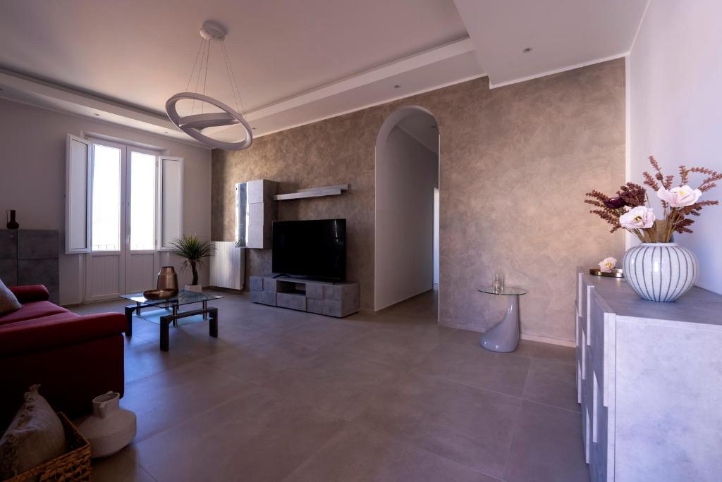 Televízia a/alebo spoločenská miestnosť v ubytovaní Appartamenti La Fenice