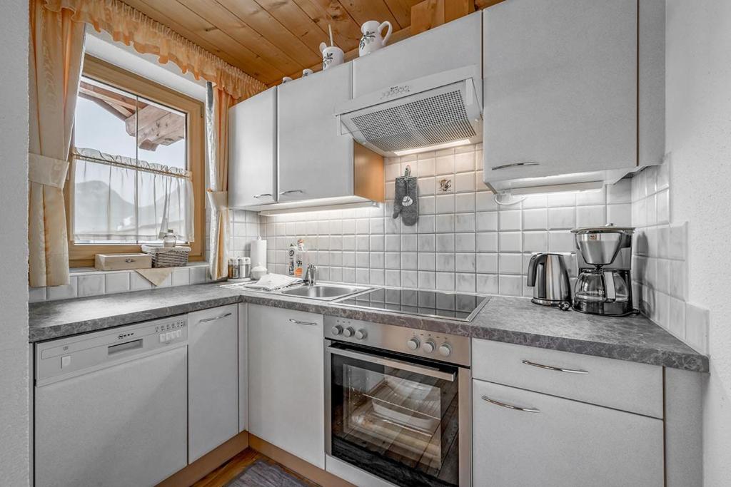 Kuchyň nebo kuchyňský kout v ubytování Appartement Breitlehn