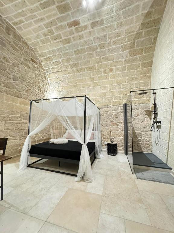Postel nebo postele na pokoji v ubytování Amalè Suite 25 Medioevo Design