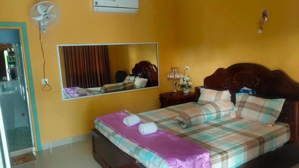 Postel nebo postele na pokoji v ubytování Mabuhay Guesthouse Kampot