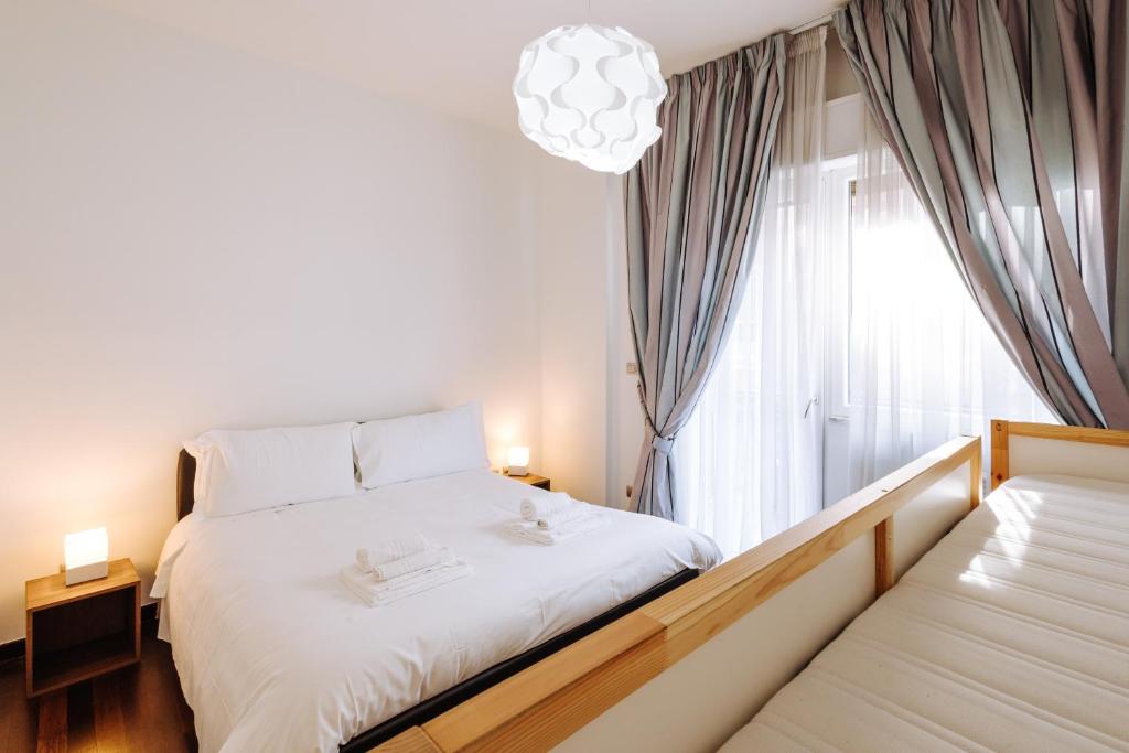 Rúm í herbergi á Piccinni Exclusive Suite