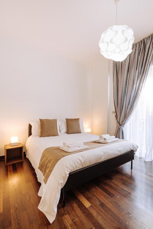 Rúm í herbergi á Piccinni Exclusive Suite