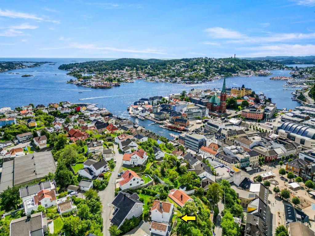an aerial view of a city and a river at Sentrum - Koselig hus med parkering in Arendal