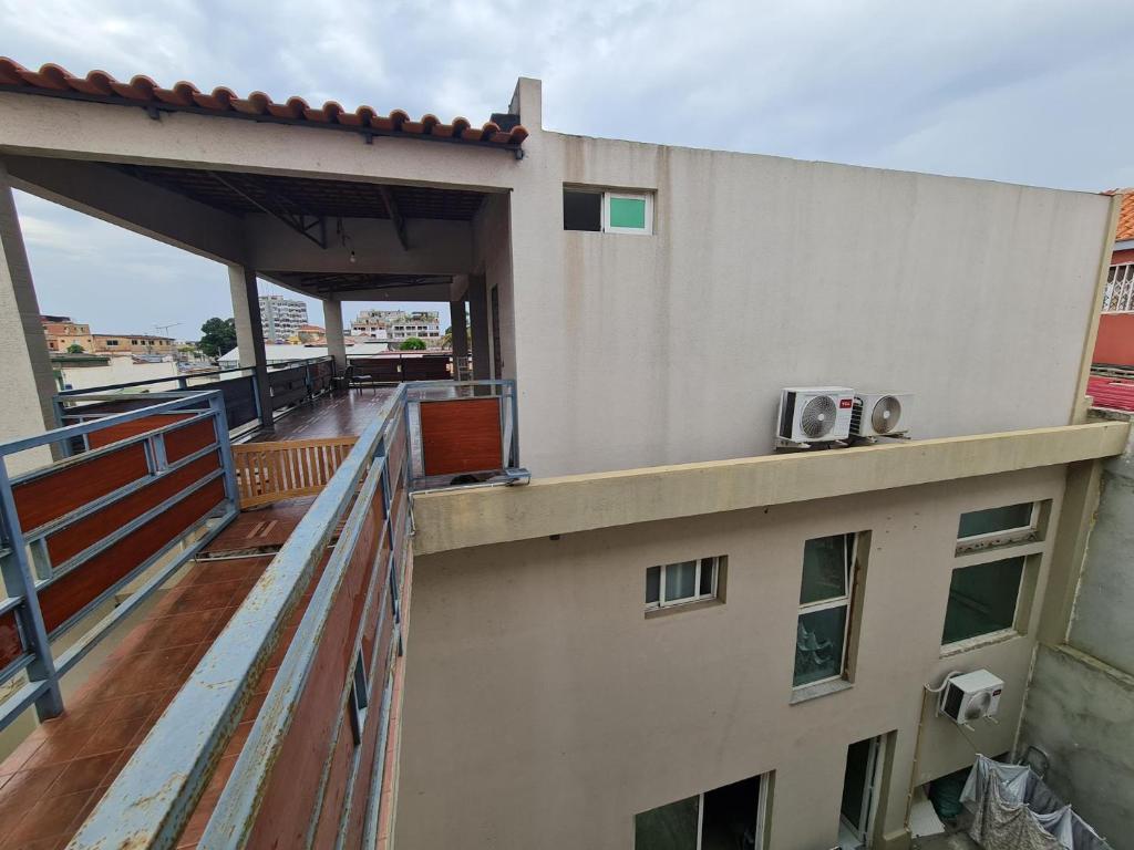 a balcony of a building with two speakers on it at Lovely 1-Bed Apartment in Luanda in Luanda
