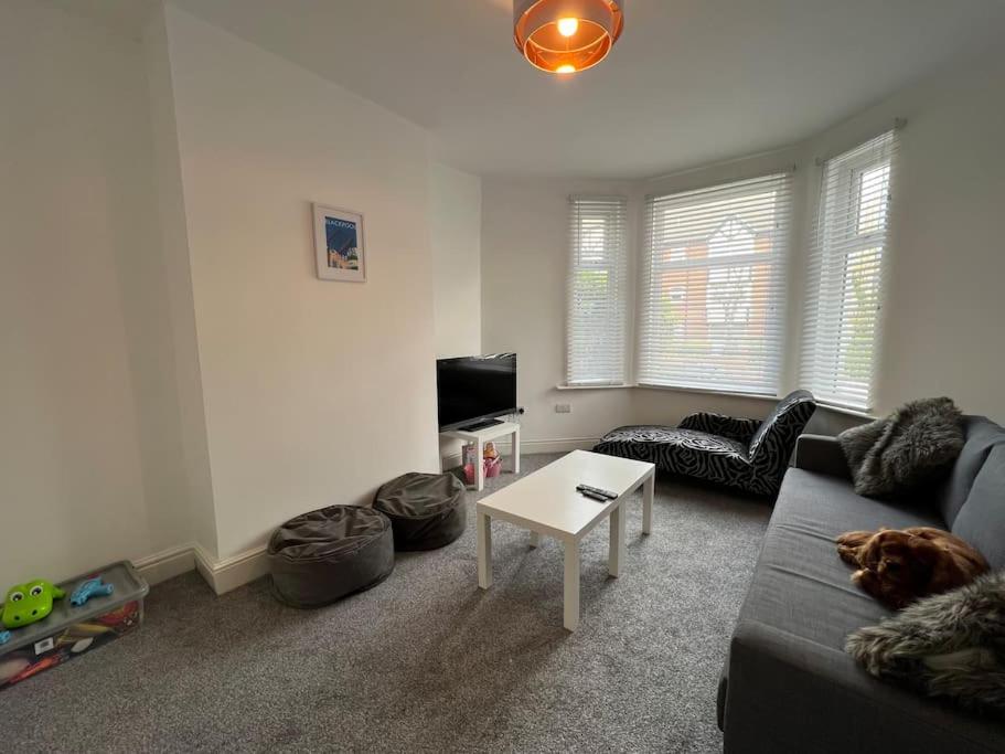 a living room with a couch and a table at New Flat in Lytham St Annes - Sleeps 4 in Saint Annes on the Sea