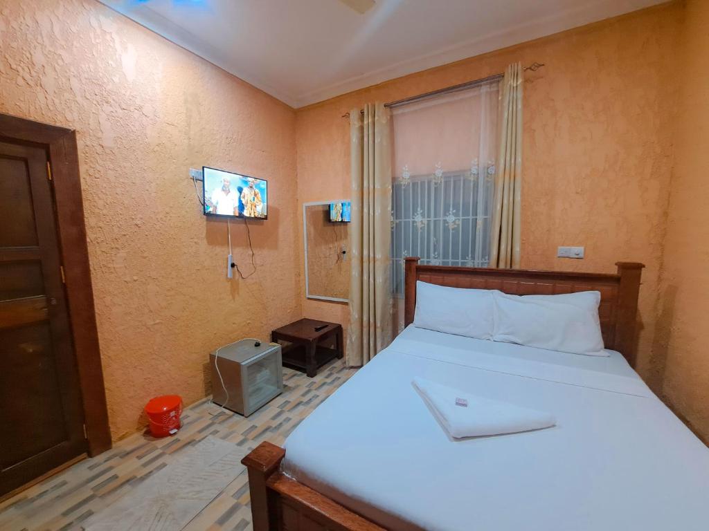 Postel nebo postele na pokoji v ubytování Best Point Hotel Zanzibar
