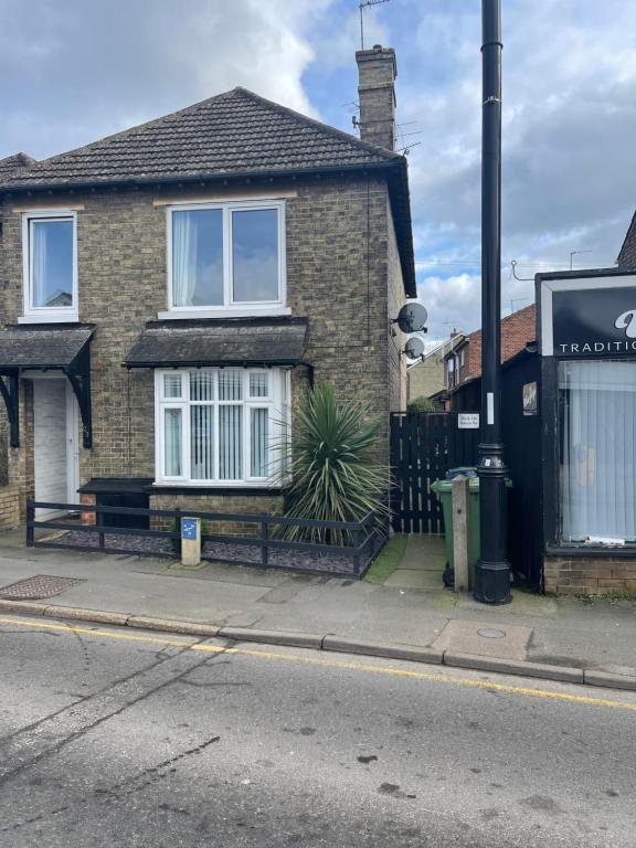 a brick house on the side of a street at Lovely 2-Bed Apartment in the very Centre of March in March