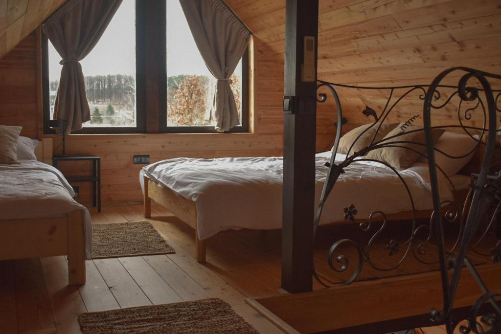 Postel nebo postele na pokoji v ubytování Ozoni & Sauna