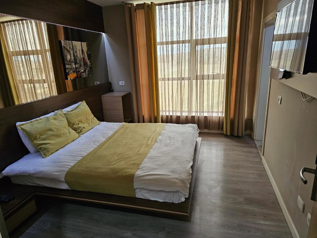 Postel nebo postele na pokoji v ubytování HOTEL BENITA