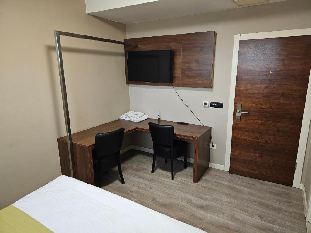 Postel nebo postele na pokoji v ubytování HOTEL BENITA