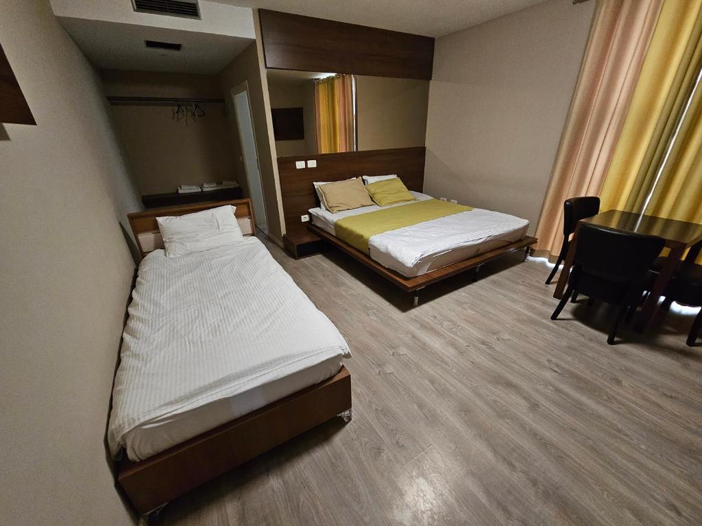 Postel nebo postele na pokoji v ubytování HOTEL BENITA