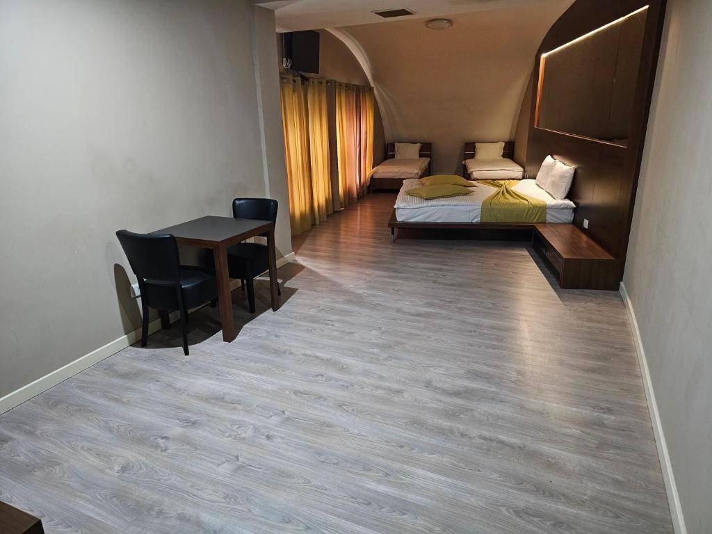 Postel nebo postele na pokoji v ubytování HOTEL BENITA
