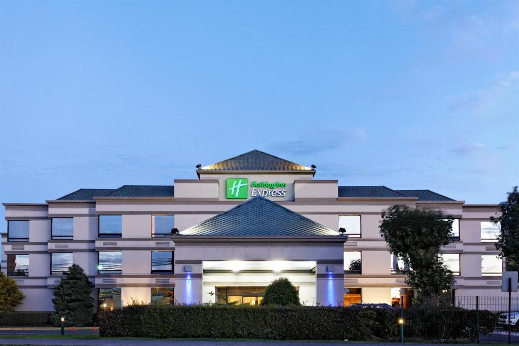 a hotel with a sign on the front of it at Holiday Inn Express - Concepcion, an IHG Hotel in Concepción