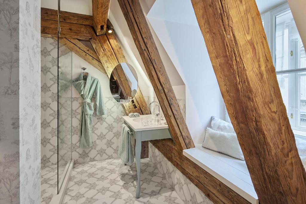 a bathroom with a shower and a sink at The Leo Grand in Vienna