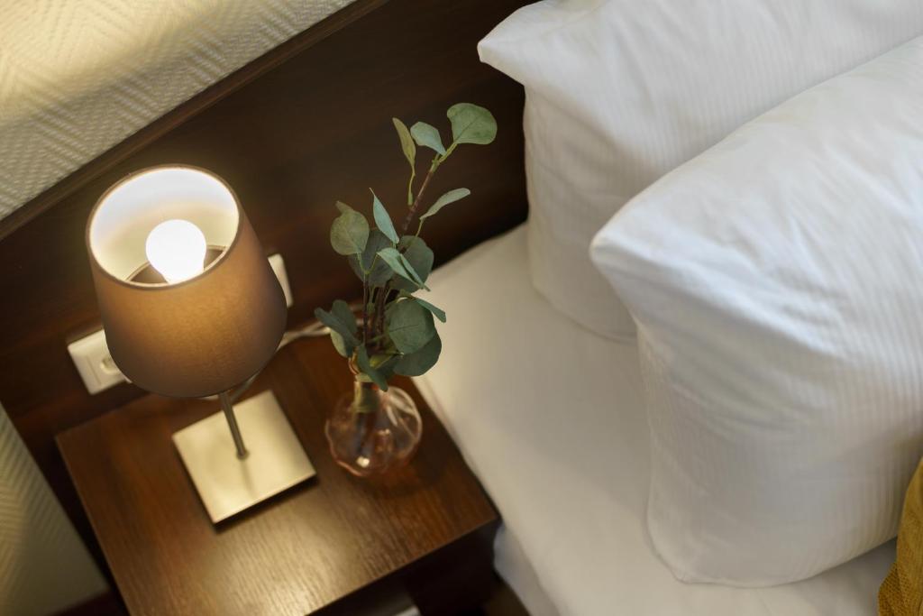 Postel nebo postele na pokoji v ubytování Hotel Alte Wache