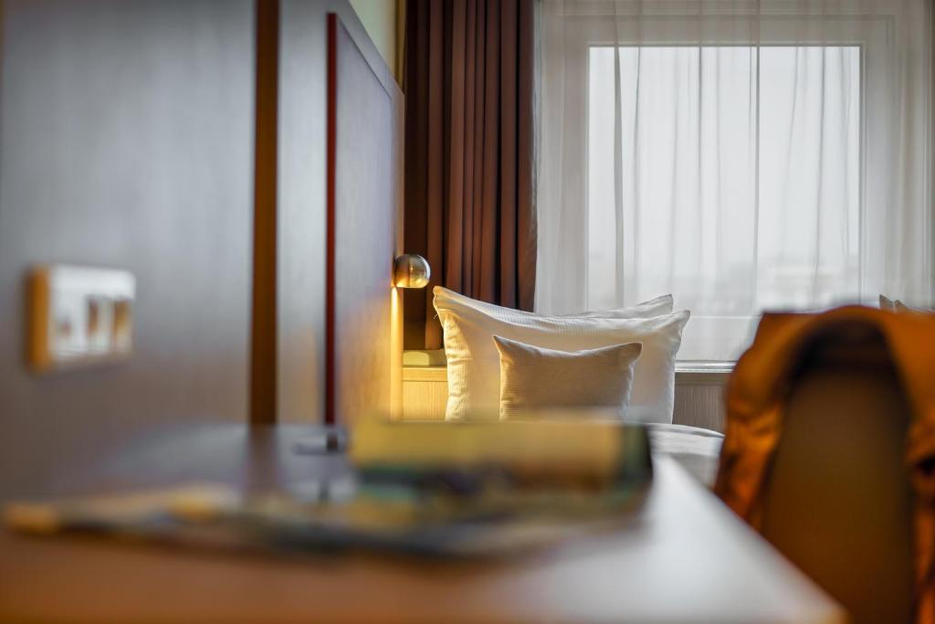 Postel nebo postele na pokoji v ubytování Hotel Alte Wache