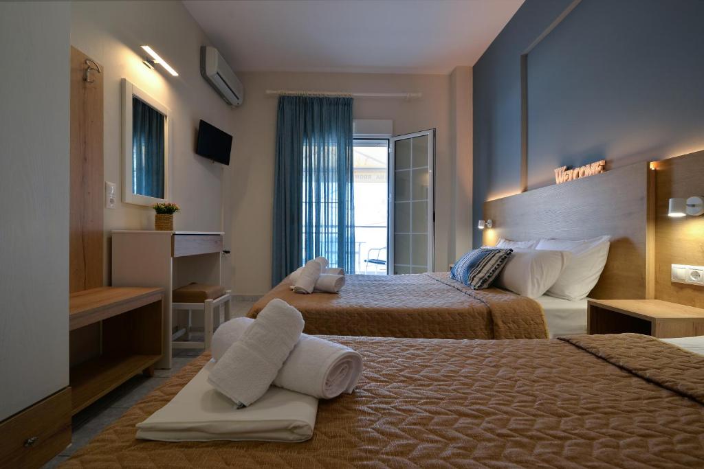 Postel nebo postele na pokoji v ubytování PERASMA ROOMS