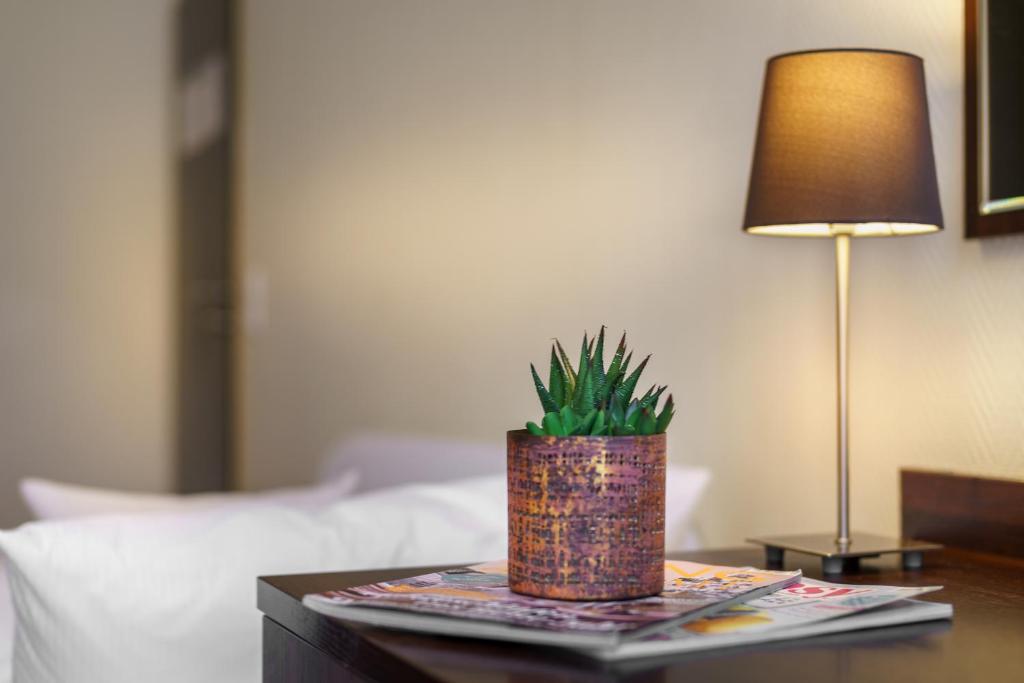 Postel nebo postele na pokoji v ubytování Hotel Alte Wache