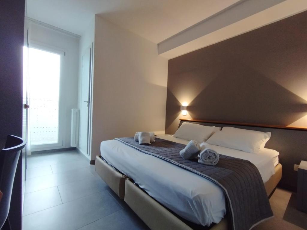 Posteľ alebo postele v izbe v ubytovaní Hotel Excelsior