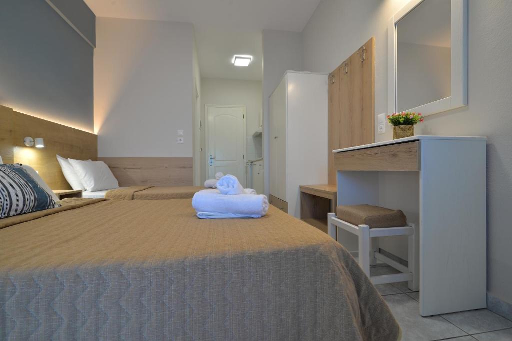 Postel nebo postele na pokoji v ubytování PERASMA ROOMS