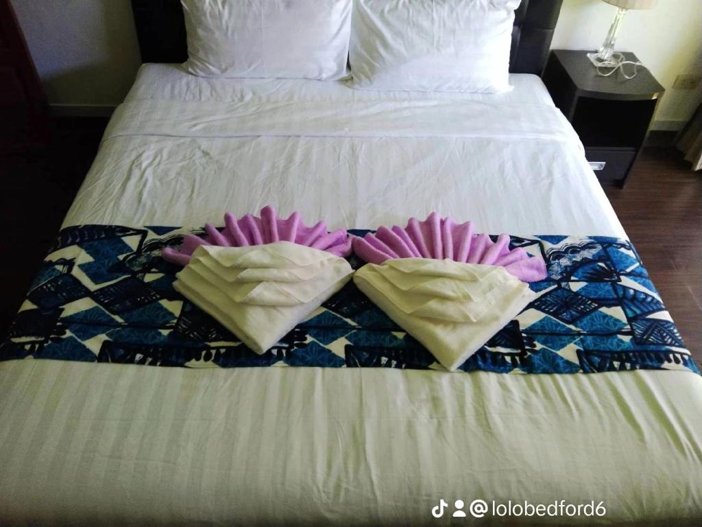 Postel nebo postele na pokoji v ubytování the L Hua Hin