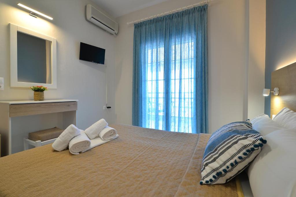 Postel nebo postele na pokoji v ubytování PERASMA ROOMS