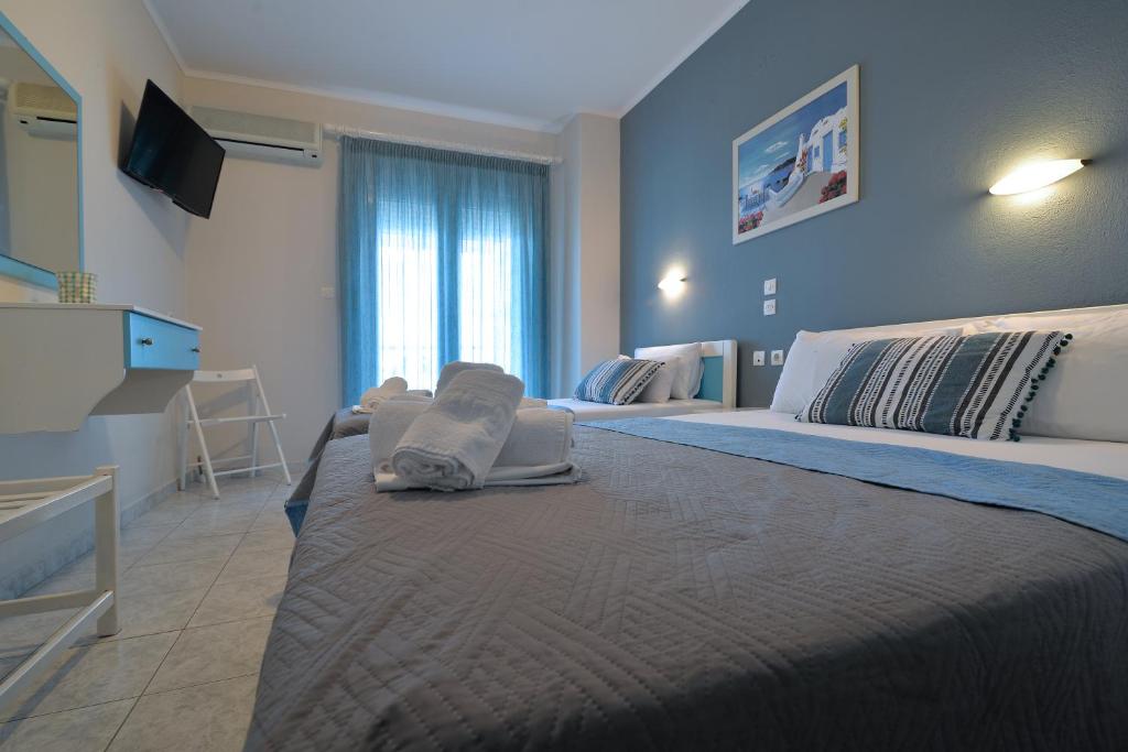 Postel nebo postele na pokoji v ubytování PERASMA ROOMS