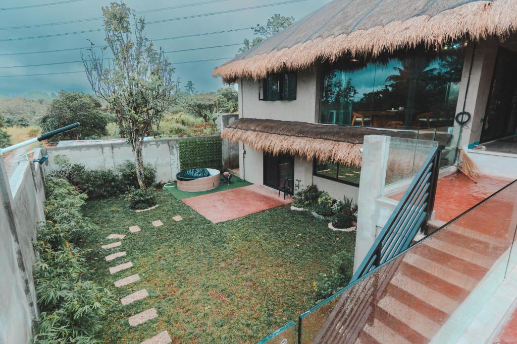 a house with a yard with a fence at Shalmari's Hut in South Tambo