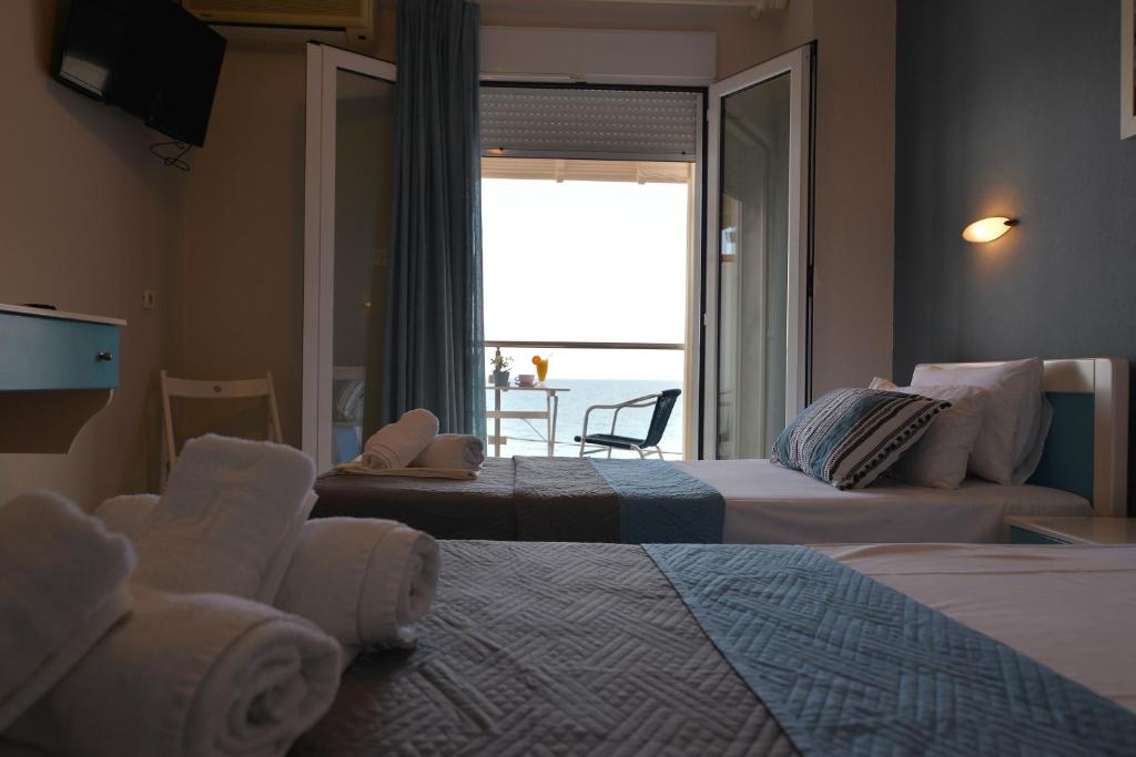 Postel nebo postele na pokoji v ubytování PERASMA ROOMS