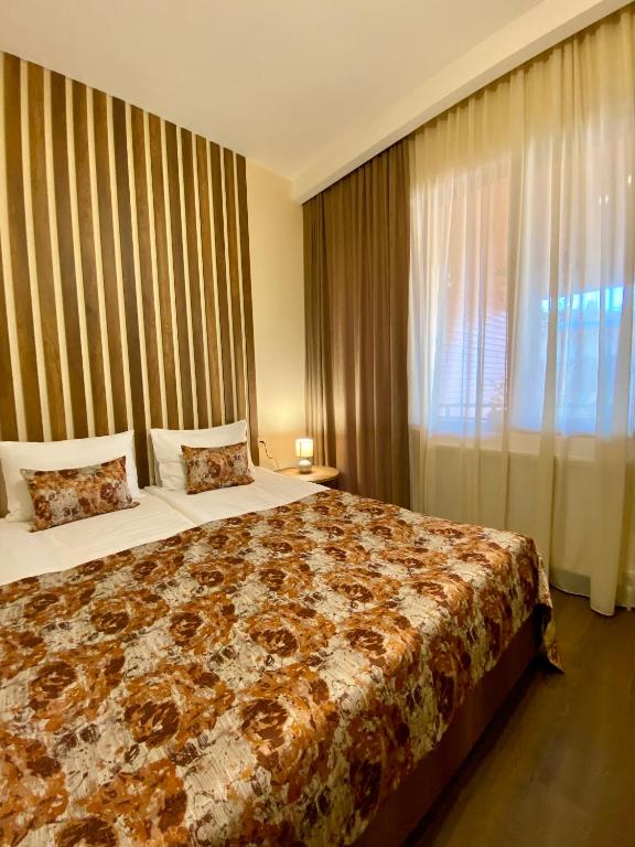 Postel nebo postele na pokoji v ubytování Kera Rooms